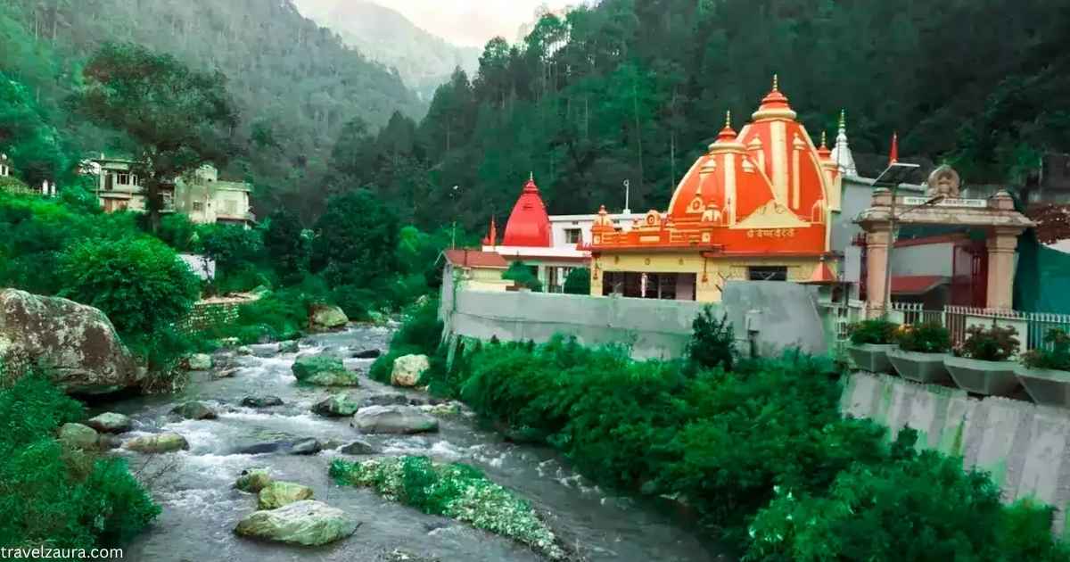 Kainchi Dham temple entrance surrounded by green Kumaon hills.