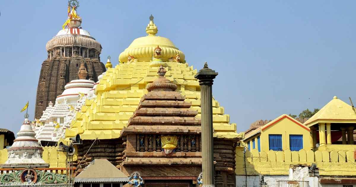 Jagannath Temple Puri spire against a blue sky.