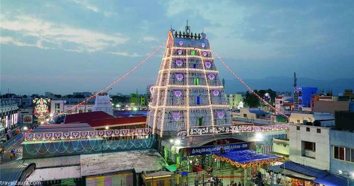 Tiruchanoor Temple golden gopuram with pilgrims during Padmavathi darshan.