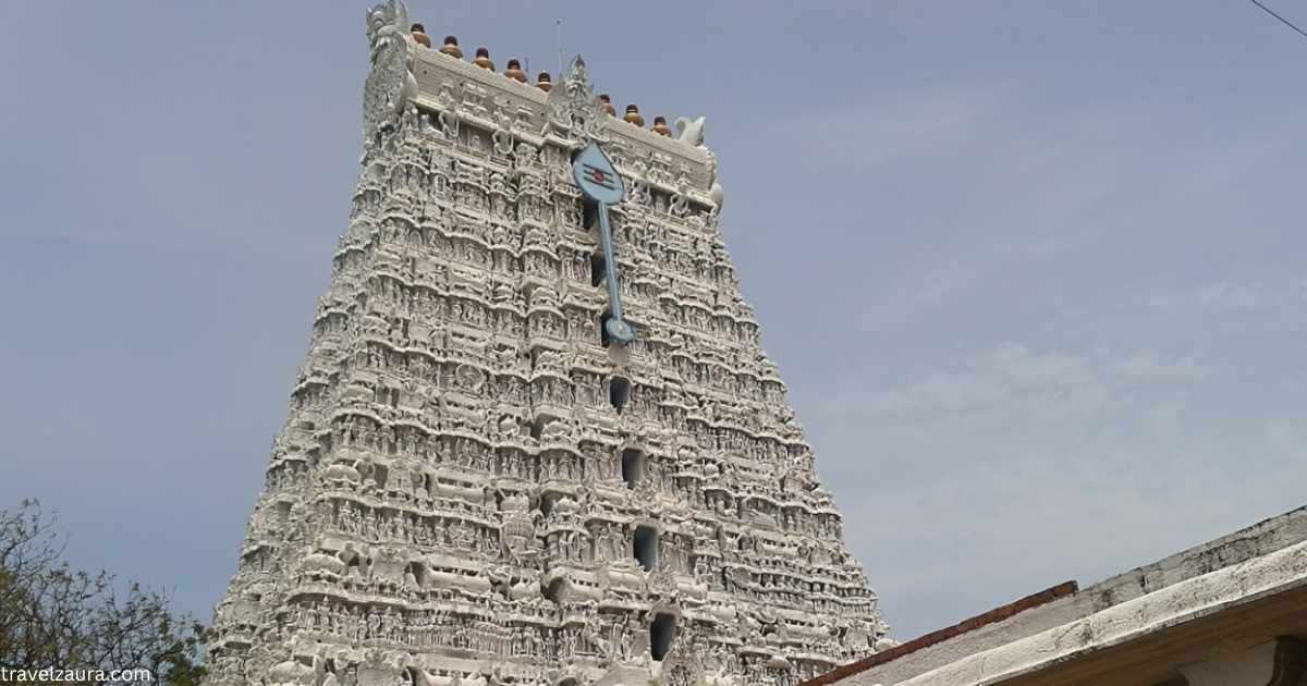 Tiruchendur Murugan Temple gopuram at sunrise by the Bay of Bengal.