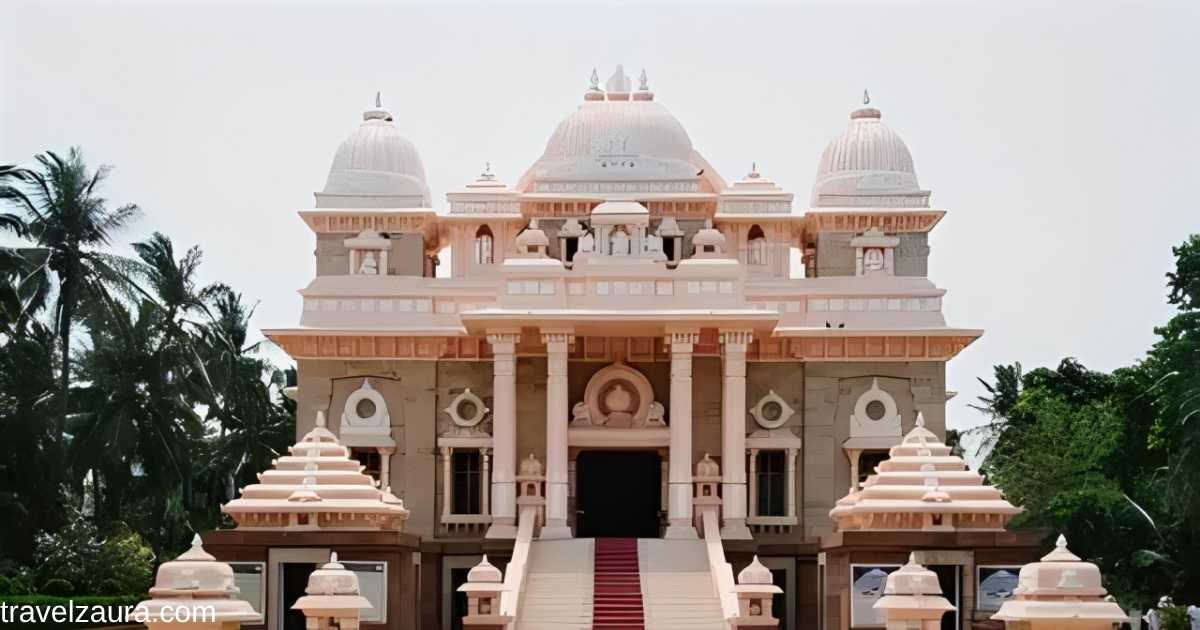 Hindu mandir with ornate tower during evening prayer.