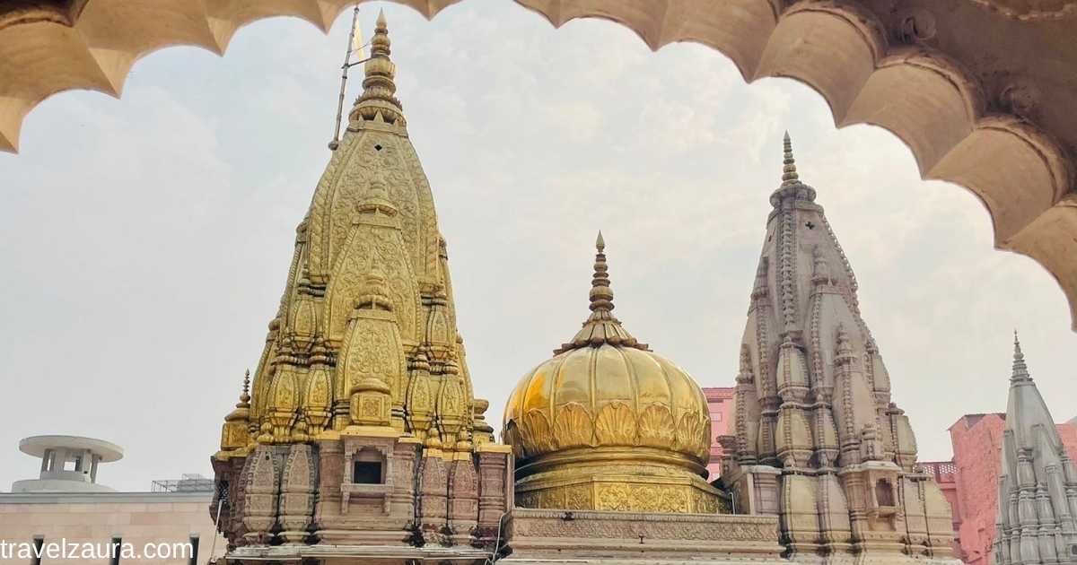 Kashi Vishwanath Temple golden spires at dusk, Varanasi.