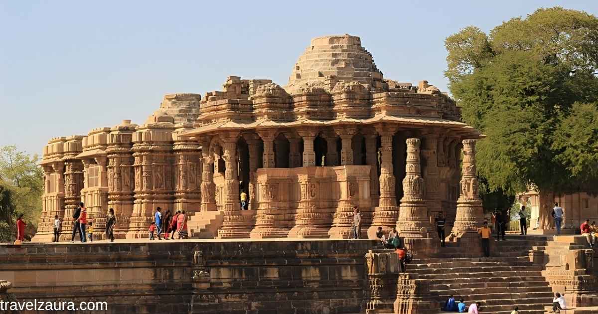 Modhera Sun Temple at sunrise with Surya Kund in the foreground.