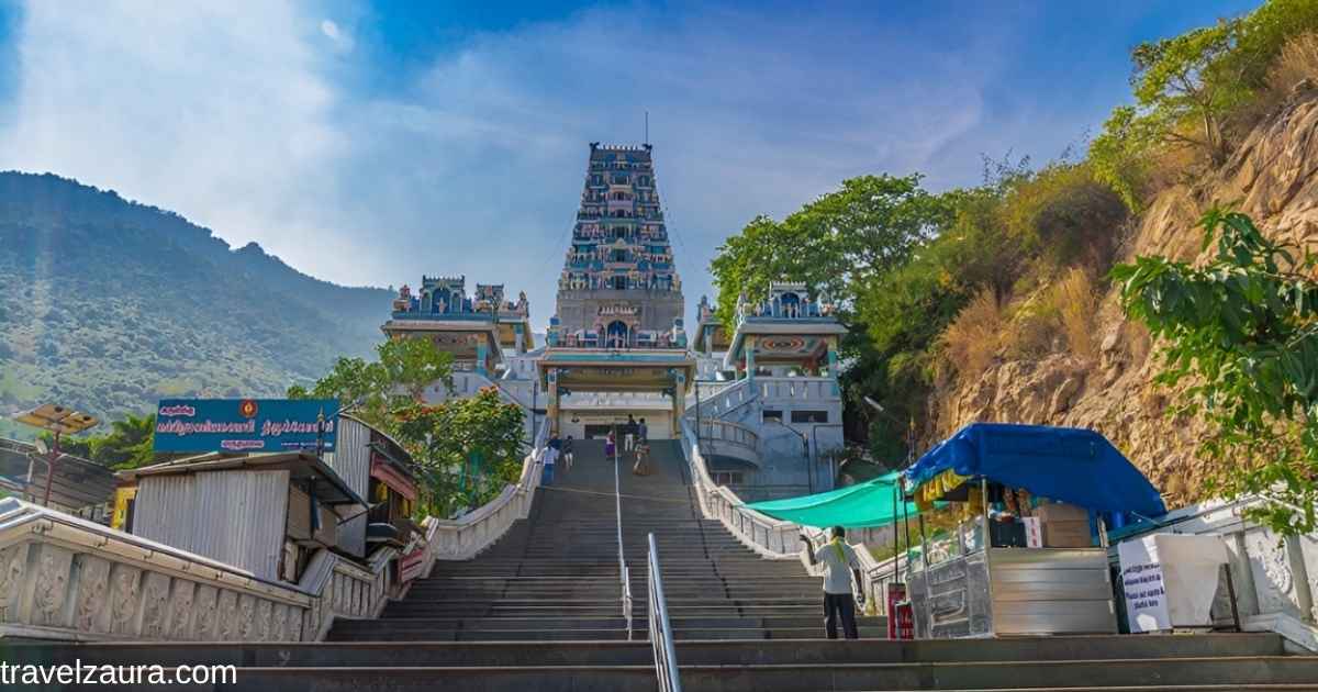 Pathala Sembu Murugan Temple cave entrance with stone steps in Palani Hills.