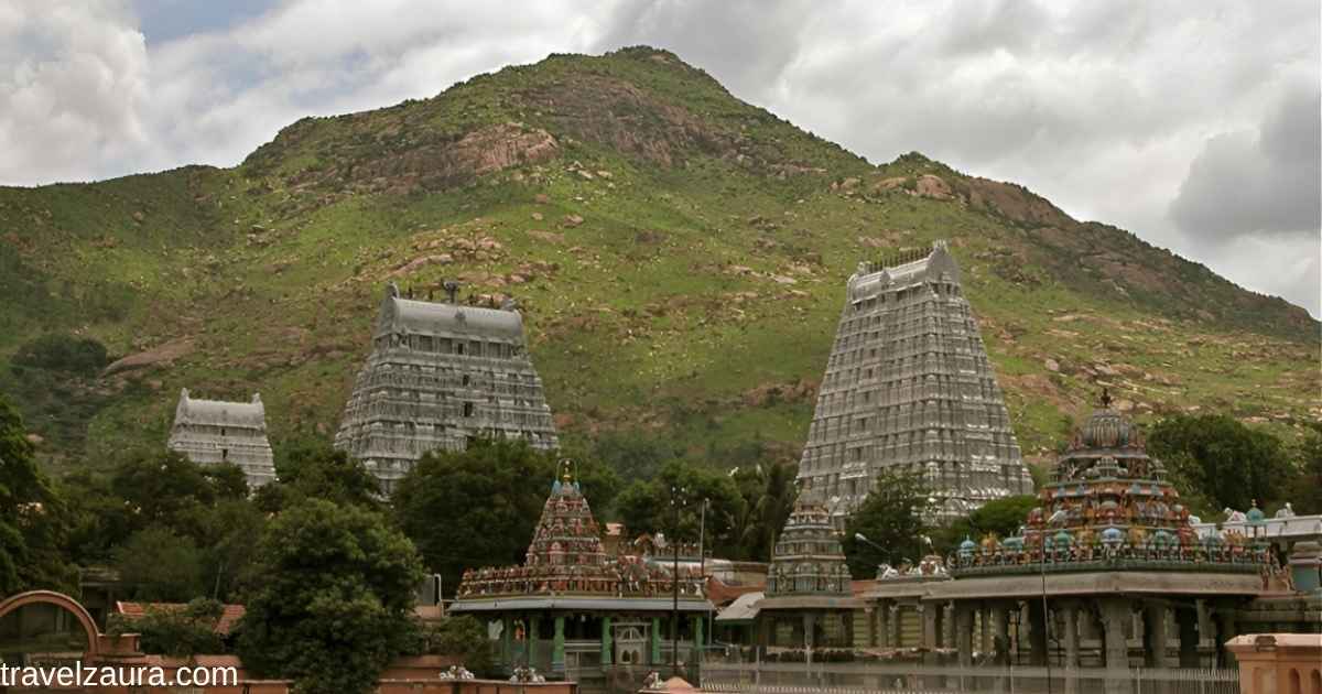 Devotees enter Arunachaleswarar Temple's gopuram in Tiruvannamalai.